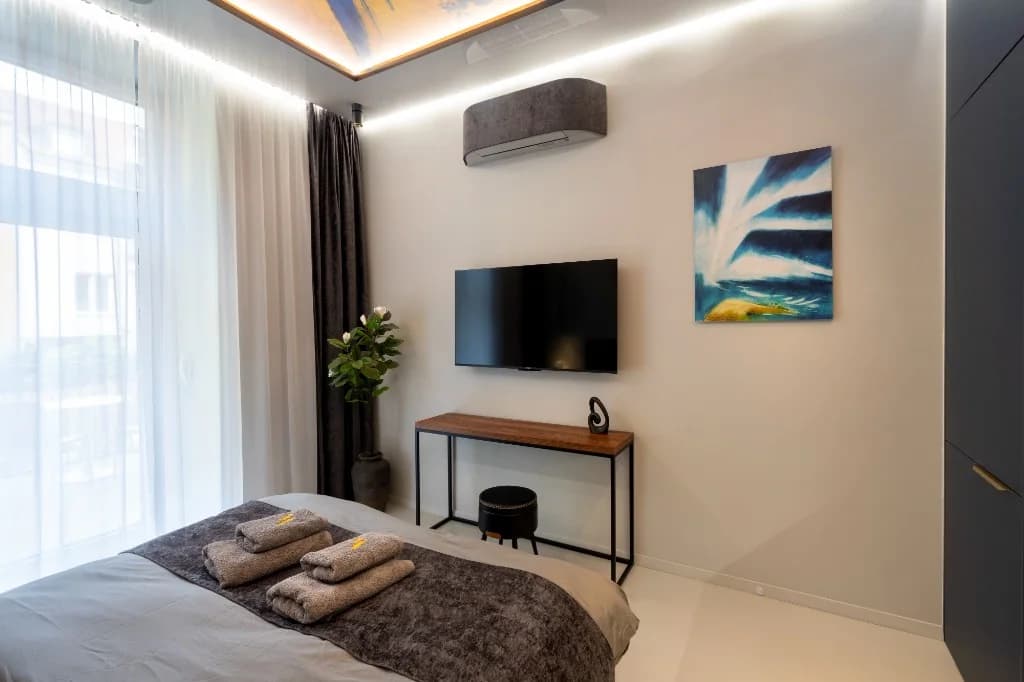 Evening Elegance – room with TV and a small table